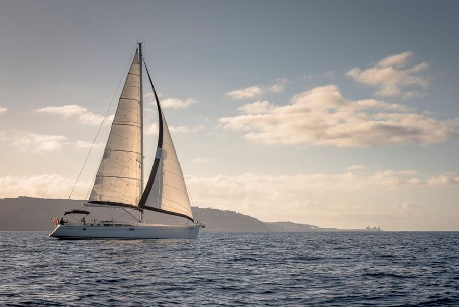From Puerto de Mogán: Sailboat Trip with Food and Drinks - Timing, language, and cancellation details