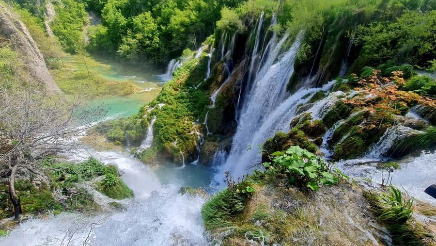 From Zadar: Plitvice Lakes Day Trip with Guide and Boat Tour - Wooden paths, waterfalls, and the first big views