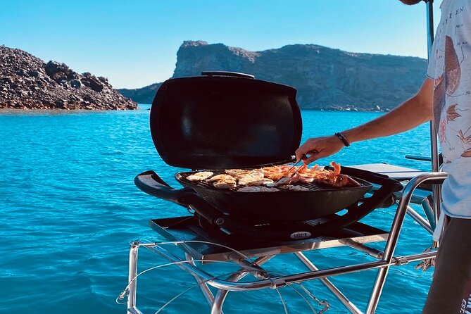 Half-Day Exclusive Catamaran Cruise in Santorini with Meal and Open Bar - Thirassia Island and the main meal