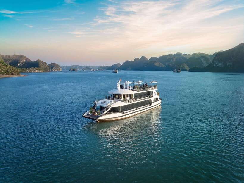 Halong Bay: Luxury Day Cruise with Buffet, Kayak, Swim - Boarding the boat and settling in for lunch