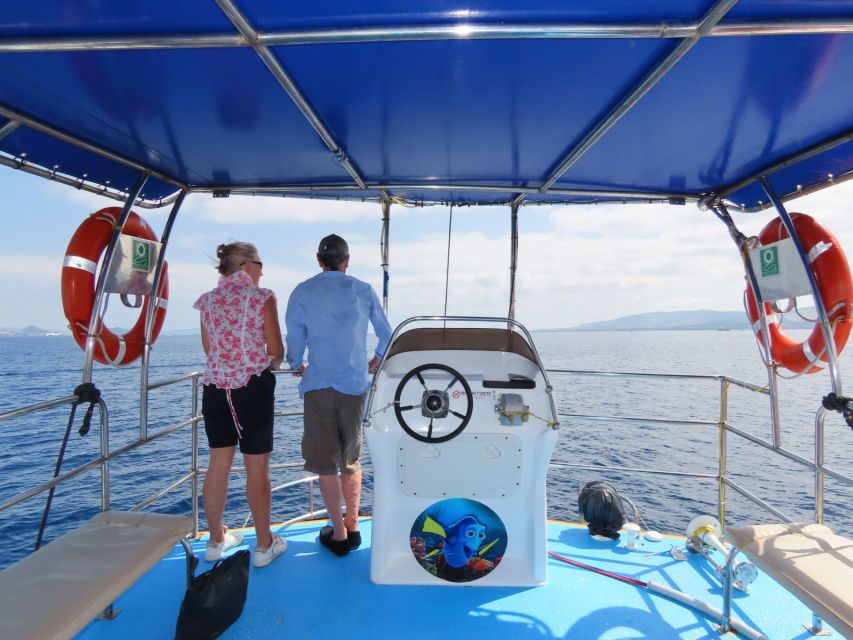 Kos Town: Glass-Bottom Boat Cruise with Swimming Stops - Seating, sun, music, and sea conditions