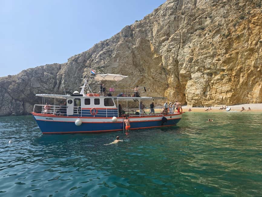 Krk: Golden Beach and Blue Cave Cruise with Welcome Drink - Swimming into Plavnik Cave