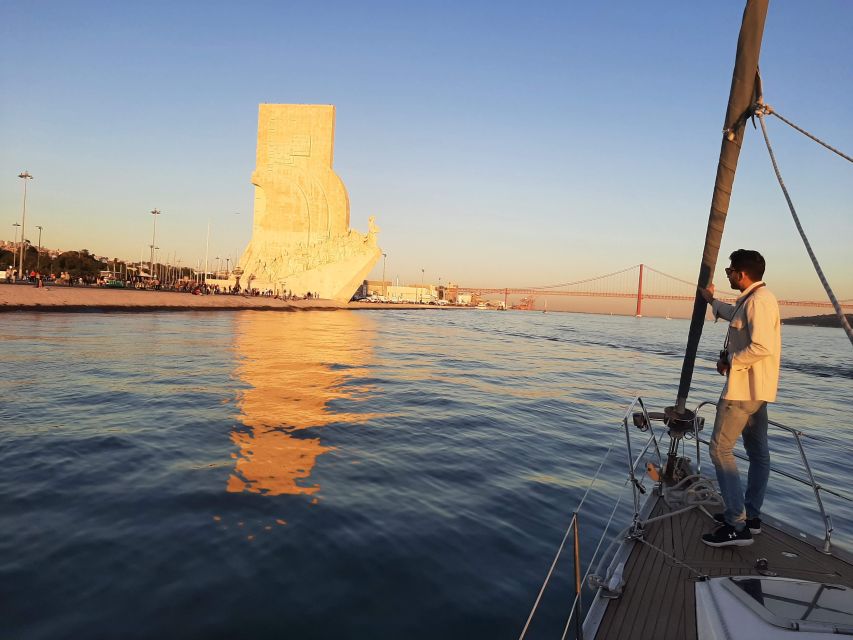 Lisbon: City Skyline Sailboat Cruise with Drink and Snacks - Sailing under the 25 de Abril Bridge