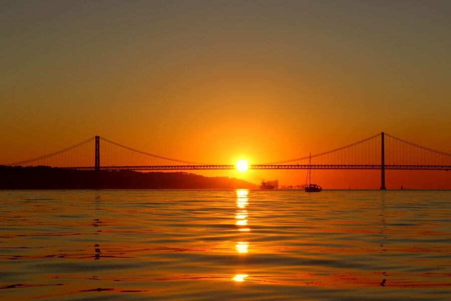Lisbon: Daylight or Sunset on a Vintage Sailboat - Under the 25 de Abril Bridge and toward Christ the King