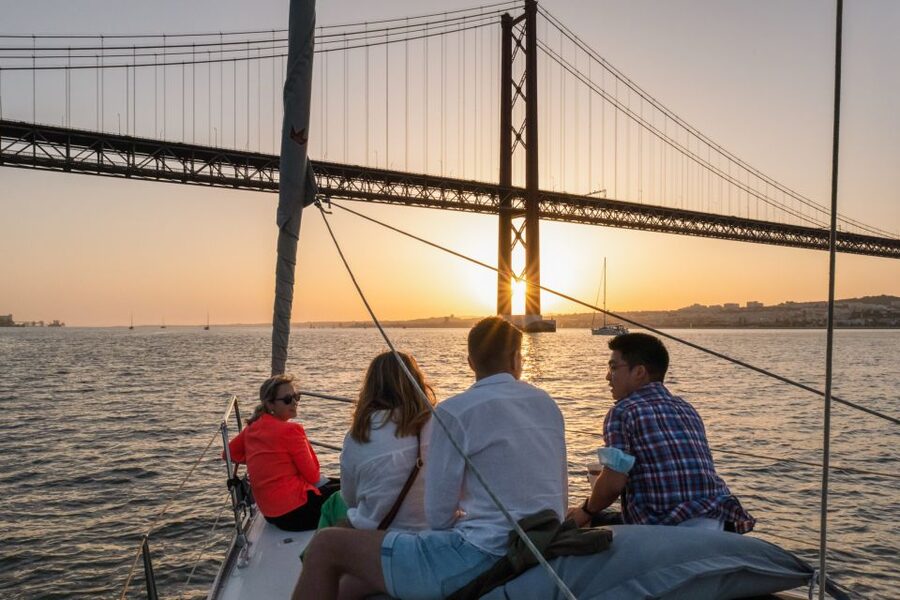 Lisbon: Daytime/Sunset/Night City Sailboat Tour with Drink - Under the 25 de Abril Bridge