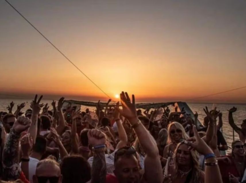 Lisbon: Sunset Boat Party Cruise with DJ and Open Bar - Commerce Square from the water