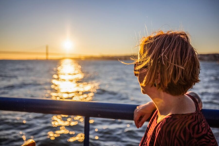 Lisbon: Sunset Cruise with Live DJ and Drinks - The sunset viewpoint and the 25th April Bridge