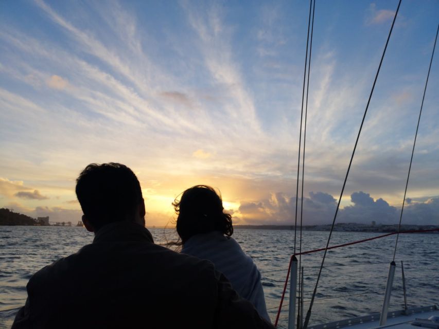 Lisbon: Sunset Sailing with Portuguese Wine and History - The 25 de Abril Bridge overhead