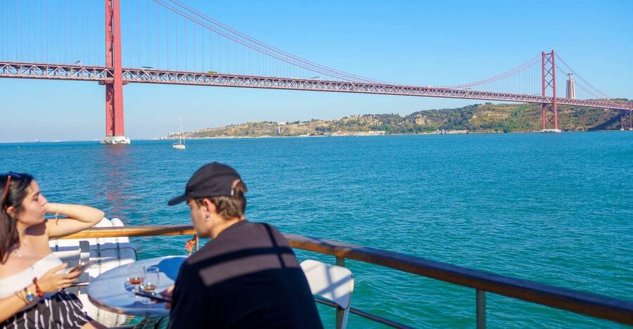 Lisbon: Tagus River Cruise with Welcome Drink - Passing beneath the 25 de Abril Bridge