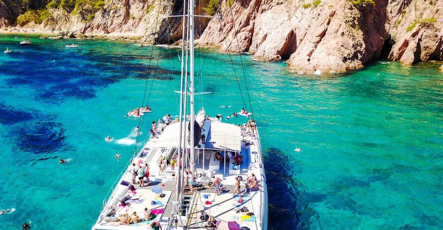 Lloret de Mar: Catamaran Sailing Cruise with BBQ and Drinks - Two hours at anchor for swimming and water play
