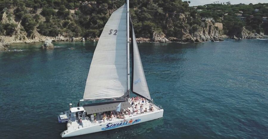 Lloret de Mar: Sunset Catamaran Cruise with DJ and Drinks - Setting off from Passeig Agustí Font