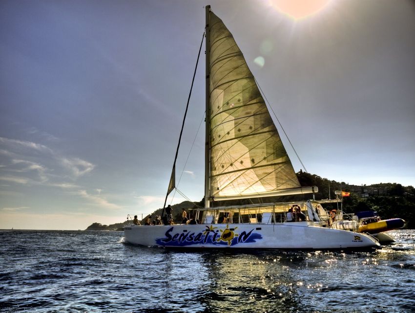 Lloret de Mar: Sunset Catamaran Cruise with DJ and Drinks - What the $41 price really covers
