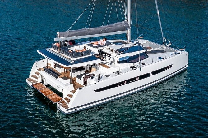 Mykonos: Brand-New Catamaran Cruise with Meal, Drinks & Transport - Leaving Mykonos behind by catamaran