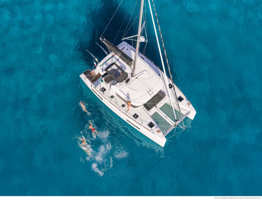 Mykonos: Catamaran Cruise with Lunch, Drinks and Transfer - Leaving Mykonos with the crew