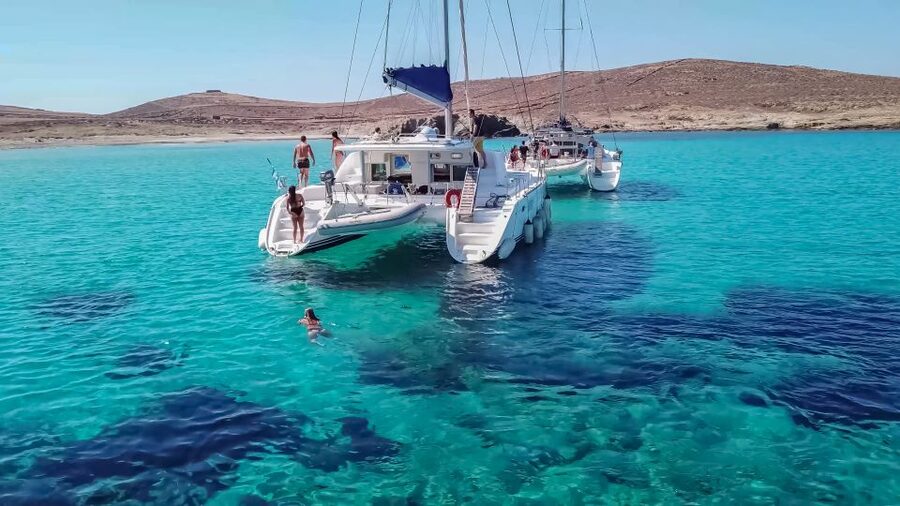 Mykonos: Catamaran Cruise with Lunch, Drinks and Transfer - The return to Mykonos and sunset option