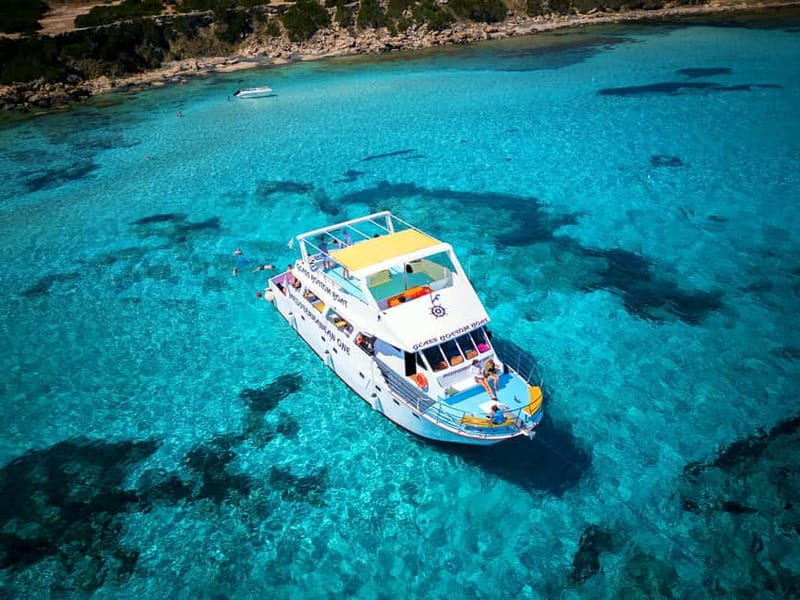 Paphos: Blue Lagoon Boat Adventure with Bus Transfer - Cruising the wild Akamas coast