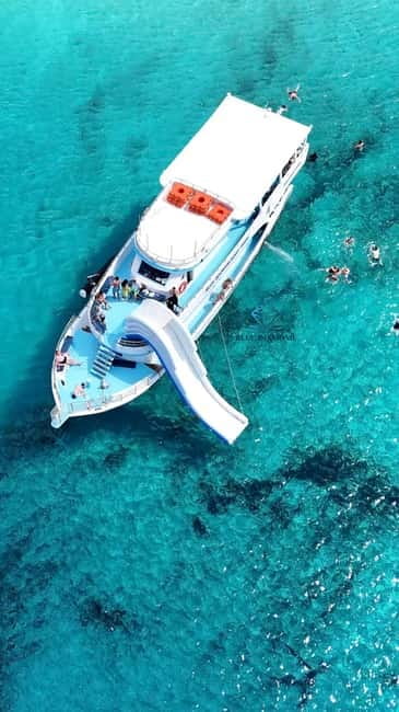 Paphos Blue Lagoon Cruise: Slide, Music & Hotel Transfer - Cruising the Akamas Peninsula