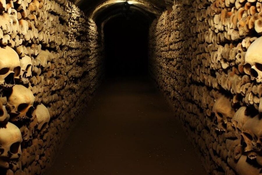 Paris: Catacombs, Audio Guide, and River Cruise Option - Walking through Paris’s underground burial chambers