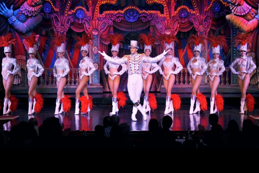 Paris: First Show Moulin Rouge with Champagne & Seine Cruise - Champagne, clothing, and the compulsory cloakroom