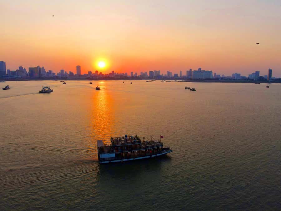 Phnom Penh: Sunset Cruise with Unlimited Beer &Fruit platter - Drinks, fruit, and the social side of the boat