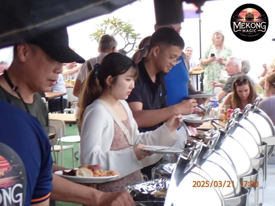 Phnom Penh: Sunset Cruise with Unlimited Beers & BBQ Buffet - Watching Phnom Penh from the Mekong