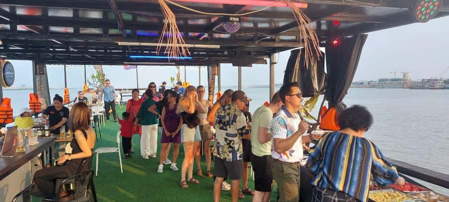 Phnom Penh: Sunset Cruise with Unlimited Beers & BBQ Buffet - From golden light to city lights