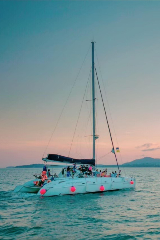 Phuket: Coral Island Catamaran Cruise with Sunset Dinner - Transport, timing, and group size