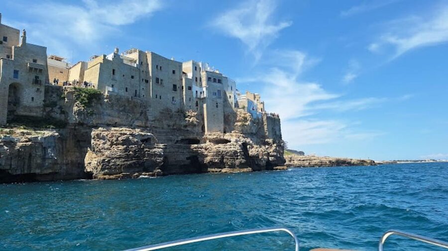 Polignano's coast and caves: a boat tour with drinks, swimming, music, and fun - San Vito harbor and the small-boat setup