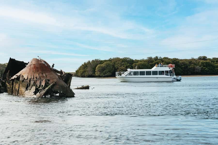 Port Adelaide: Dolphin and Ships Graveyard Cruise - Finding the boat beneath the small lighthouse