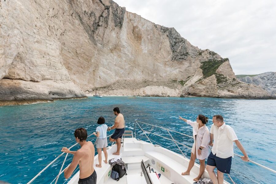 Porto Vromi: Shipwreck, Caves, & White Beach Swimming Cruise - Blue caves and the captain’s close-up driving