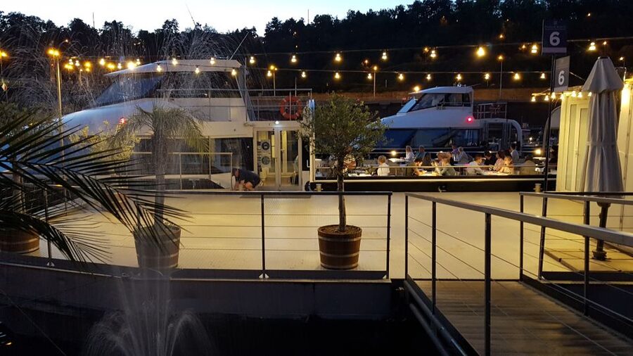 Prague: City Tour and Dinner Cruise with Hotel Pickup - Boarding the Vltava boat