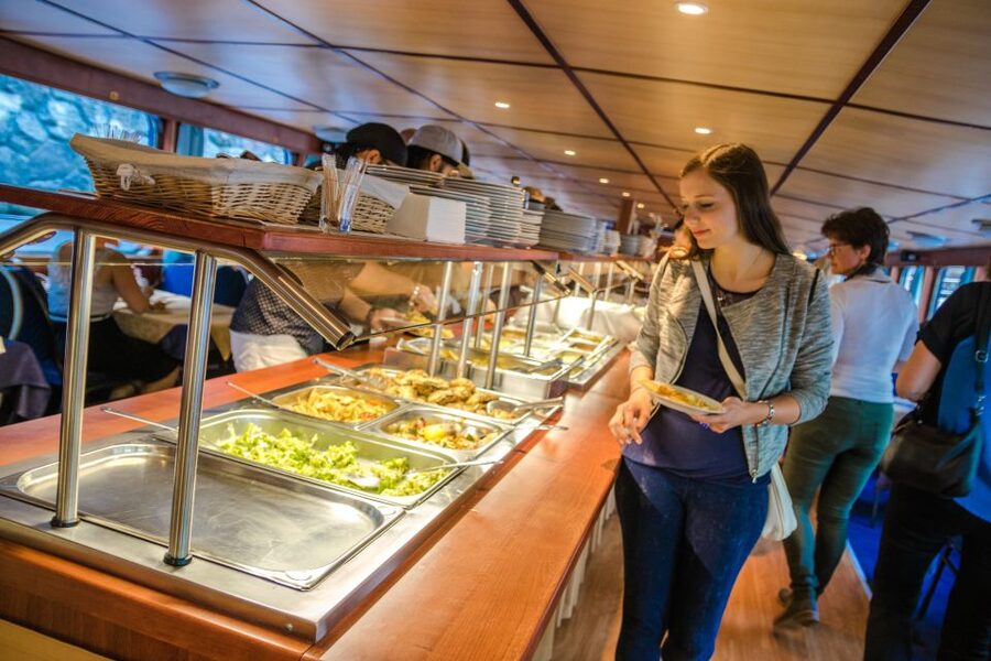 Prague: Sightseeing Boat Cruise with Buffet Dinner - An evening view of Prague from the Vltava