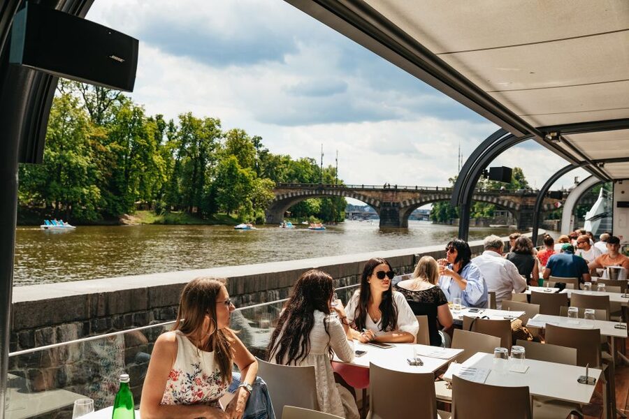 Prague: Vltava River Lunch Cruise in an Open-Top Glass Boat - The accordion music sets the mood