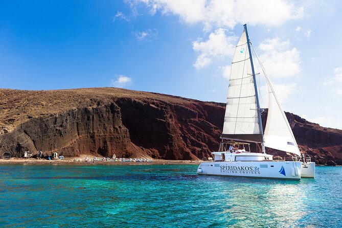Premium Small-Group Catamaran Cruise with BBQ, Open Bar, Transfer - Why seeing Santorini from a catamaran makes sense