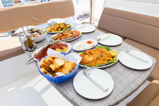 Premium Small-Group Catamaran Cruise with BBQ, Open Bar, Transfer - The lighthouse and the outer coast