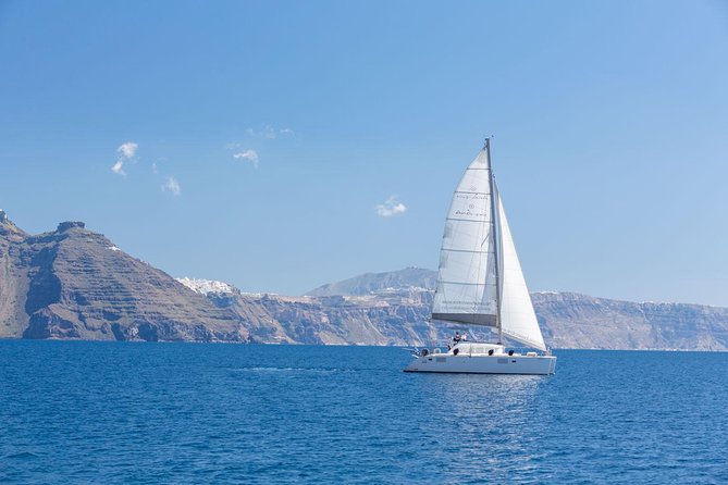 Premium Small-Group Catamaran Cruise with BBQ, Open Bar, Transfer - Nea Kameni, Thirasia, and the caldera towns