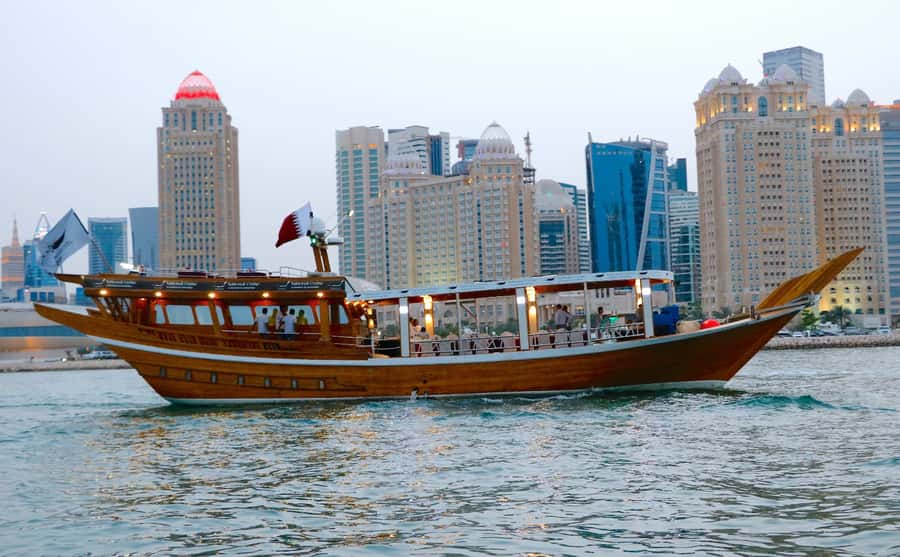 Qatar: Doha Sightseeing Cruise Onboard an Arabic Dhow Boat - A traditional dhow beneath Doha’s modern towers