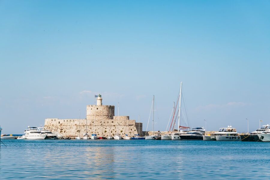 Rhodes: Sunset Catamaran Cruise with Dinner Buffet & Drinks - Sunset over Rhodes Town