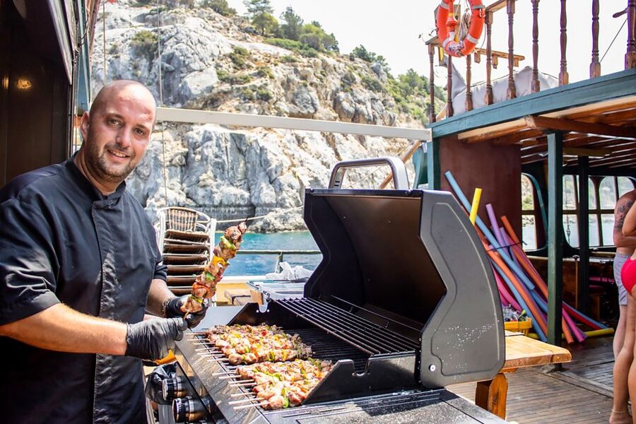 Rhodes: Sunset Cruise with Greek BBQ and Unlimited Drinks - Music, mood, and who will enjoy it most