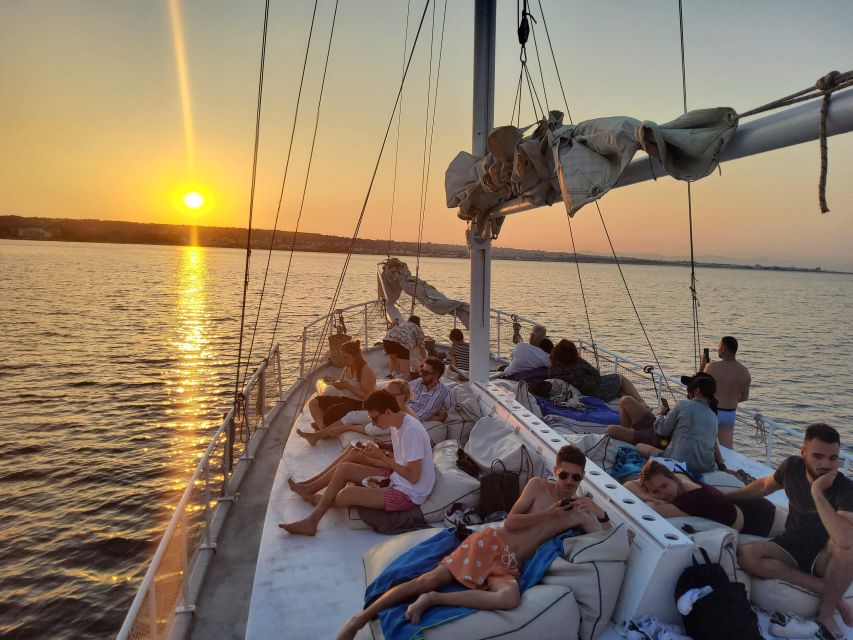 Rhodes: Sunset Cruise with Open Bar, Dinner, & Live Music - Comfort, seating, and what to pack