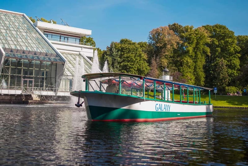 Riga: Canal Boat Sightseeing Tour With Audio guide - Kipsala’s wooden houses and the working riverfront