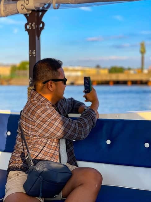 Riga: Canal Boat Sightseeing Tour With Audio guide - The captain, the audio guide, and the atmosphere onboard