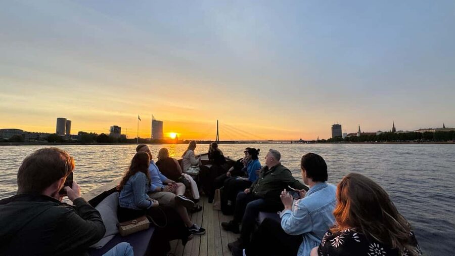 Riga: Canal Boat Tour with Welcome Drink & Audio Guide - Out onto the Daugava River beneath Riga’s bridges