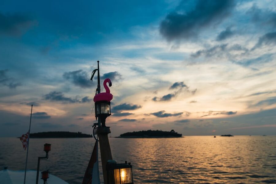 Rovinj: Sunset Cruise with Swim Stop, Drinks, and Fruits - A sunset cruise with more than a sunset