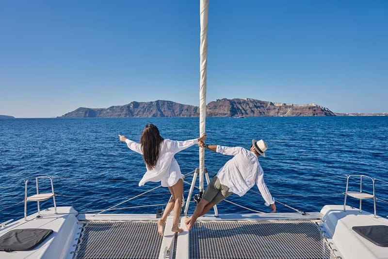 Santorini: Caldera Classic Catamaran Cruise w/ Meal & Drinks - Red Beach, where Santorini turns scarlet
