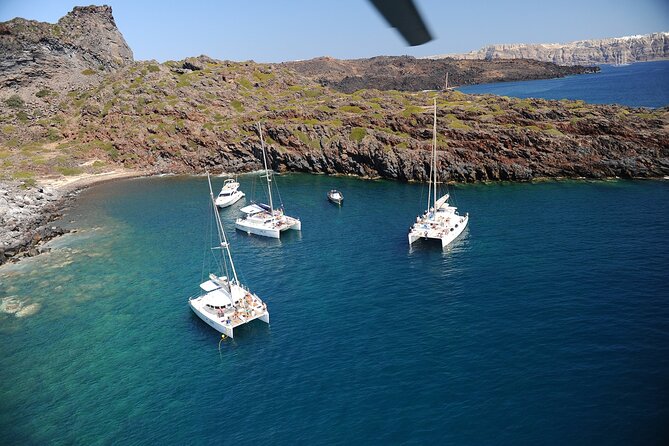 Santorini Classic Catamaran Cruise with BBQ, Drinks and Transfers - Daytime sailing or sunset cruise?