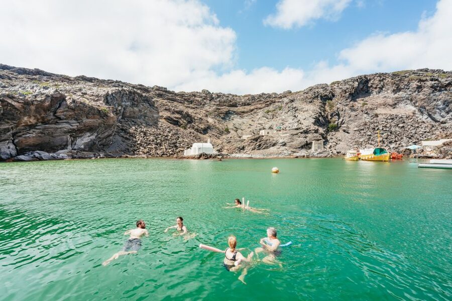Santorini: Luxury Catamaran Day Trip with Meal and Open Bar - Sailing past the volcano islands and Fira