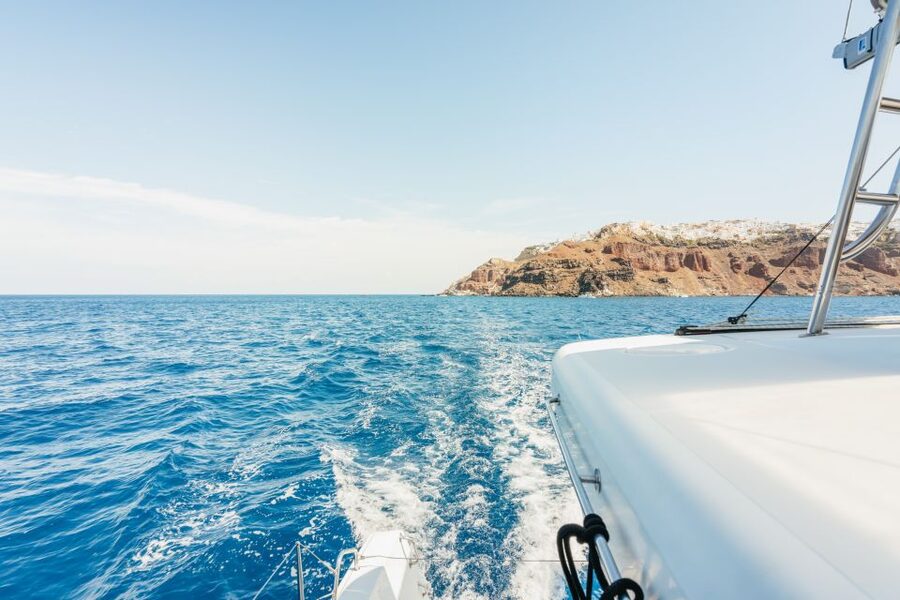 Santorini: Luxury Catamaran Day Trip with Meal and Open Bar - The sunset below Oia