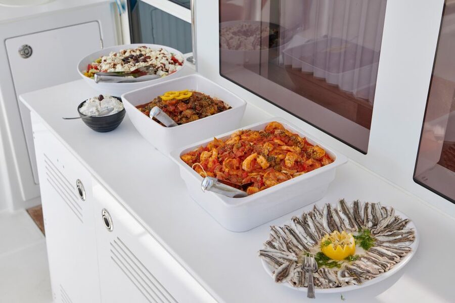 Santorini: Platinum Catamaran Cruise w/ BBQ Meal & Open Bar - Red Beach and the volcanic south coast