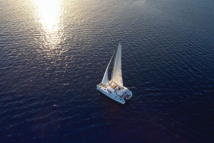 Santorini: Platinum Catamaran Cruise w/ BBQ Meal & Open Bar - Sunset near Akrotiri lighthouse